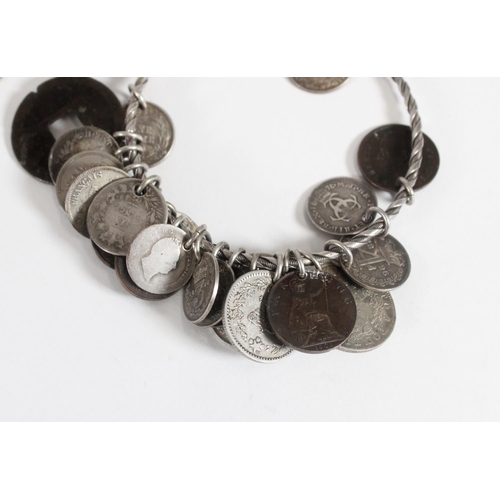 1219 - Coin art jewellery, a white metal bangle with coin charms to include Italian 1 lira 1869, British Ma... 