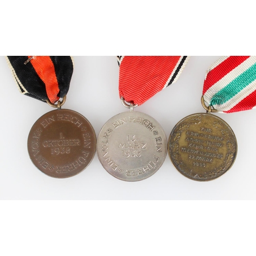 1438 - Nazi German WWII occupation medals to include Sudetenland Medal 1938 with Prague clasp, The Return o... 