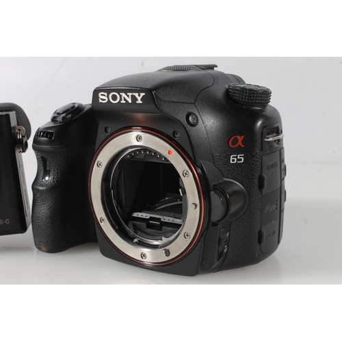 1120 - Sony Alpha 65 (A65) HD AVCHD digital camera, model number SLT-A65V, serial number 5700630, also a So... 