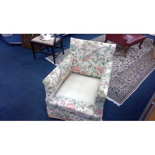 623 - Howard and Sons armchair, early 20th century, with upholstered slip cover and cushion, the castors s... 