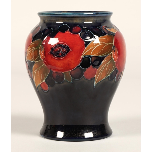 9 - Moorcroft pottery vase of baluster form, pomegranate pattern, blue signature to base, 15cm high.