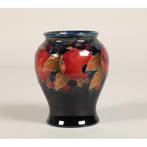 9 - Moorcroft pottery vase of baluster form, pomegranate pattern, blue signature to base, 15cm high.