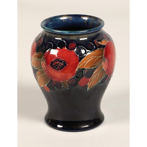 9 - Moorcroft pottery vase of baluster form, pomegranate pattern, blue signature to base, 15cm high.