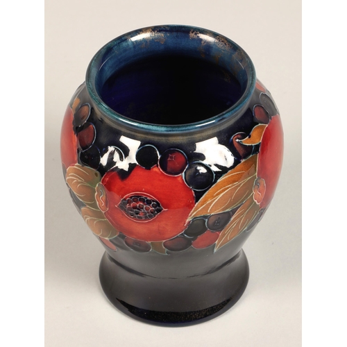 9 - Moorcroft pottery vase of baluster form, pomegranate pattern, blue signature to base, 15cm high.