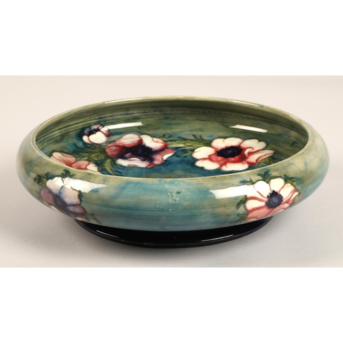 14 - Moorcroft shallow pottery bowl in the anemone pattern on blue and green ground, impressed marks and ... 