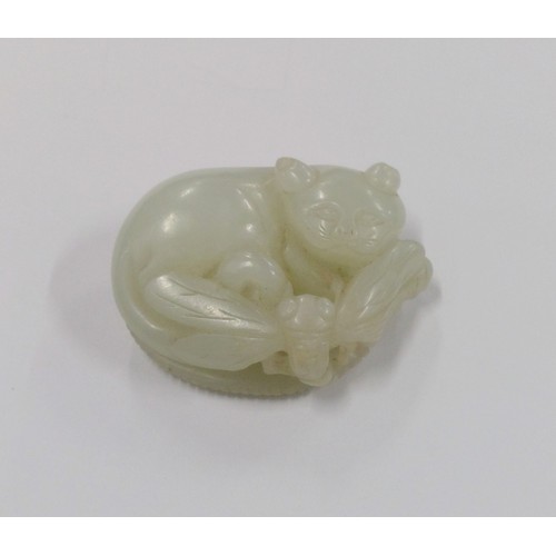 528 - Chinese Jade carved model of a cat, in pale Celadon colour, the recumbent cat with dragonfly on a le... 