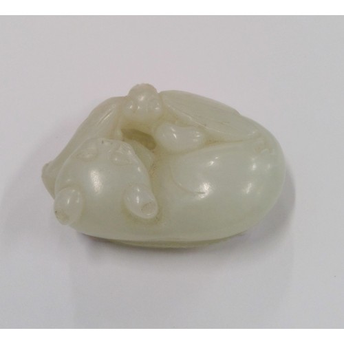 528 - Chinese Jade carved model of a cat, in pale Celadon colour, the recumbent cat with dragonfly on a le... 