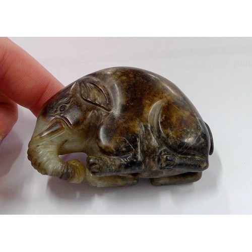 529 - Chinese russet and celadon jade carved elephant, W7.5cm.