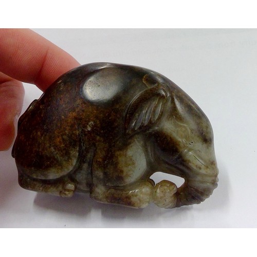 529 - Chinese russet and celadon jade carved elephant, W7.5cm.