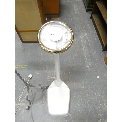 479 - Wrought iron modern standard lamp and large set of bathroom scales.