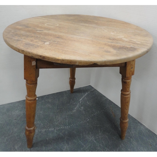 73 - Late 19th century pine cricket table, on tripod turned supports, 72cm high and 66cm wide.