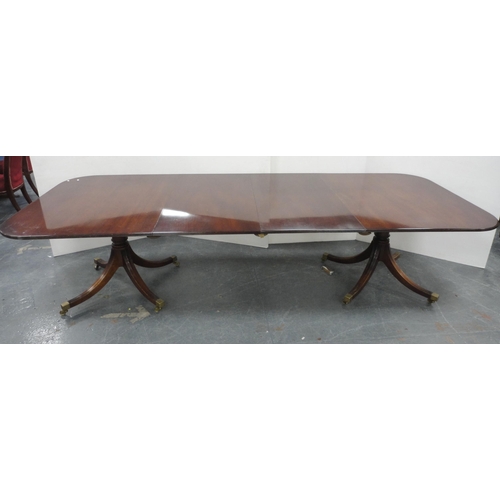 81 - Regency-style mahogany twin-pedestal dining table with two additional leaves, on quadripartite reede... 