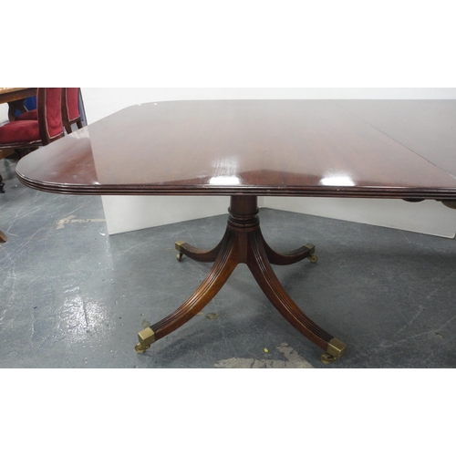 81 - Regency-style mahogany twin-pedestal dining table with two additional leaves, on quadripartite reede... 