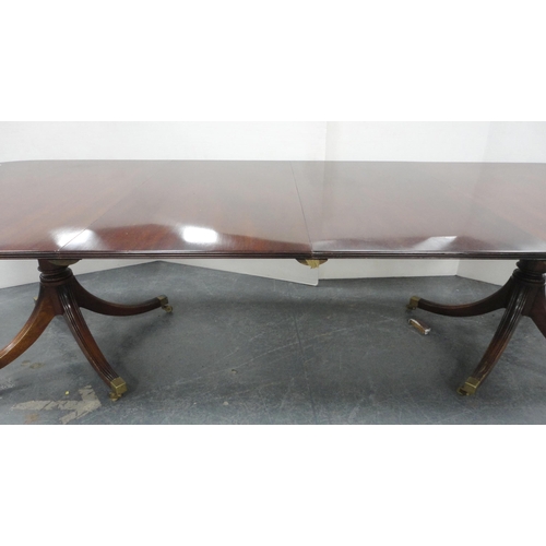 81 - Regency-style mahogany twin-pedestal dining table with two additional leaves, on quadripartite reede... 