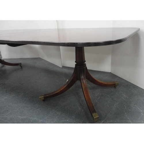 81 - Regency-style mahogany twin-pedestal dining table with two additional leaves, on quadripartite reede... 