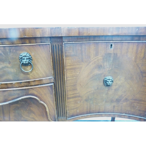 83 - Reproduction mahogany sideboard with serpentine front, fitted cutlery drawer and assorted cupboard d... 