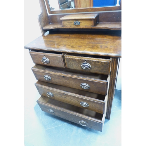 87 - Oak dressing chest, c. early 20th century, with two short and three long drawers, swing mirror above... 