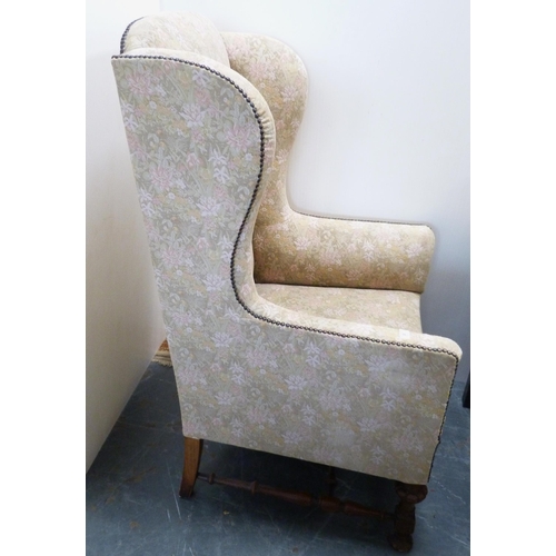 90 - William & Mary-style wing back armchair, c. early 20th century, upholstered in later studded flo... 