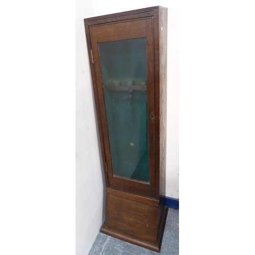 92 - Antique oak and pine-lined gun cabinet with a glazed door enclosing a fitted interior, 133cm high, 3... 