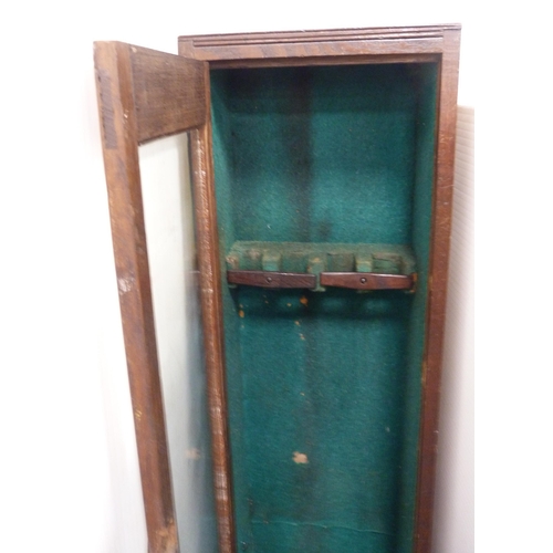 92 - Antique oak and pine-lined gun cabinet with a glazed door enclosing a fitted interior, 133cm high, 3... 