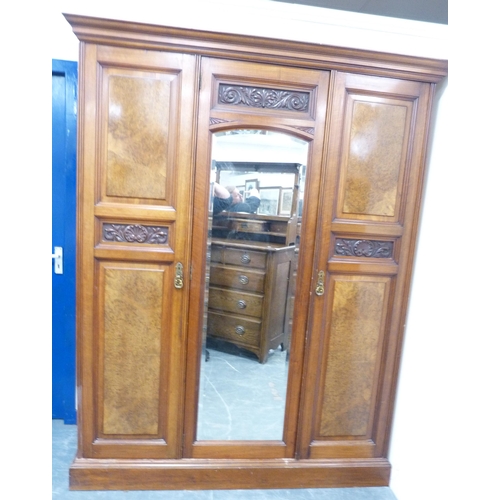 95 - Late Victorian walnut wardrobe by Wylie & Lochhead of Glasgow, with mirrored section flanked by ... 