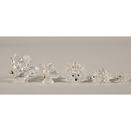 18 - Two Swarovski Crystal butterflies and three Hedgehogs. (5)