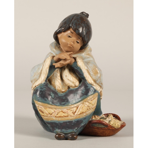 21 - Lladro Inuit figure of a seated girl with a basket 16cm