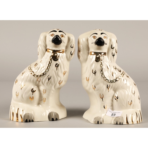 23 - Pair of Staffordshire style dogs with gilt highlights.