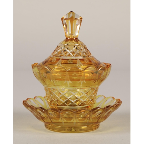 33 - Bohemian amber glass preserve jar, cover and saucer, 22cm high.