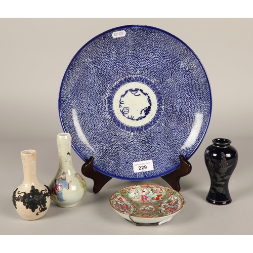 229 - Famille rose saucer dish, a Japanese blue and white plate, and two bottle vases and another. (5)