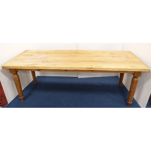 100 - Pine refectory-type dining table on turned supports, 76cm high, 182cm long and 83cm wide.