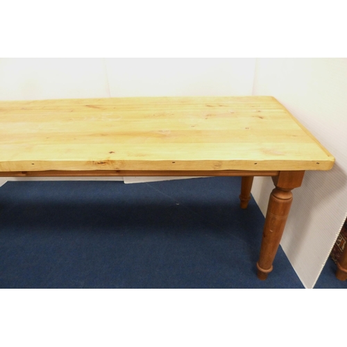 100 - Pine refectory-type dining table on turned supports, 76cm high, 182cm long and 83cm wide.