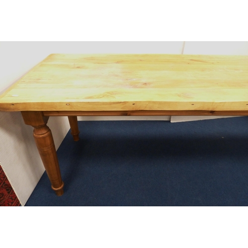 100 - Pine refectory-type dining table on turned supports, 76cm high, 182cm long and 83cm wide.