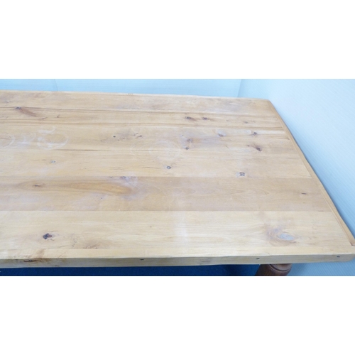 100 - Pine refectory-type dining table on turned supports, 76cm high, 182cm long and 83cm wide.