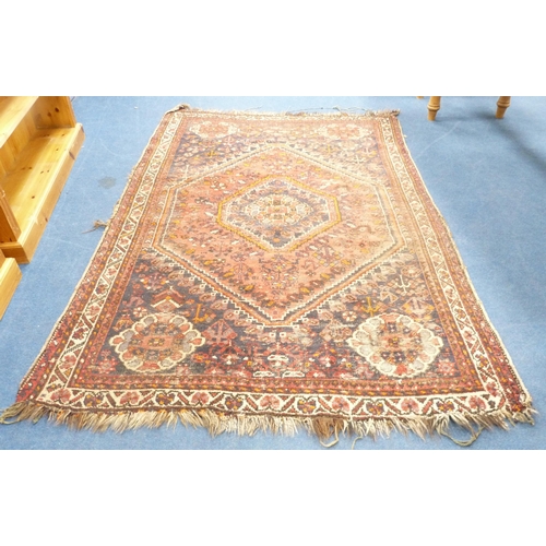 101 - Persian Shiraz hand-knotted rug in Caucasian colours, with geometric medallion to the centre flanked... 