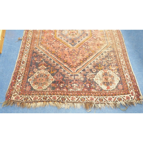 101 - Persian Shiraz hand-knotted rug in Caucasian colours, with geometric medallion to the centre flanked... 