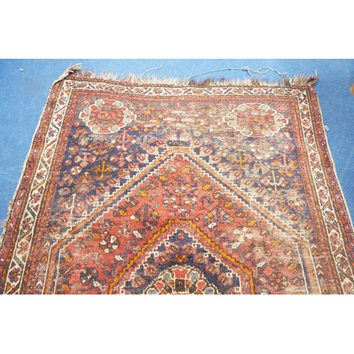 101 - Persian Shiraz hand-knotted rug in Caucasian colours, with geometric medallion to the centre flanked... 