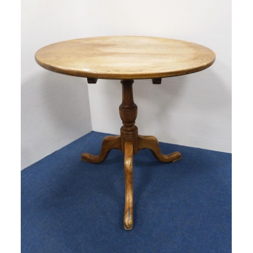 102 - George III style circular oak table with saucer top, on turned column and tripod feet, 77cm high and... 