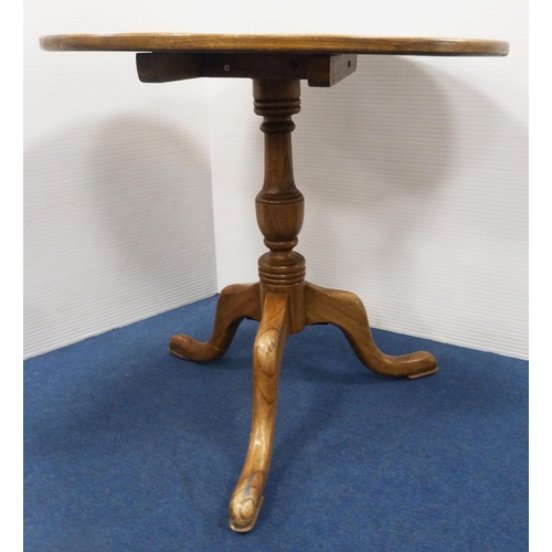 102 - George III style circular oak table with saucer top, on turned column and tripod feet, 77cm high and... 