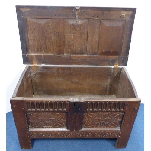 103 - 18th century oak coffer with triple panelled carved hinged top, incised carving to the front, geomet... 