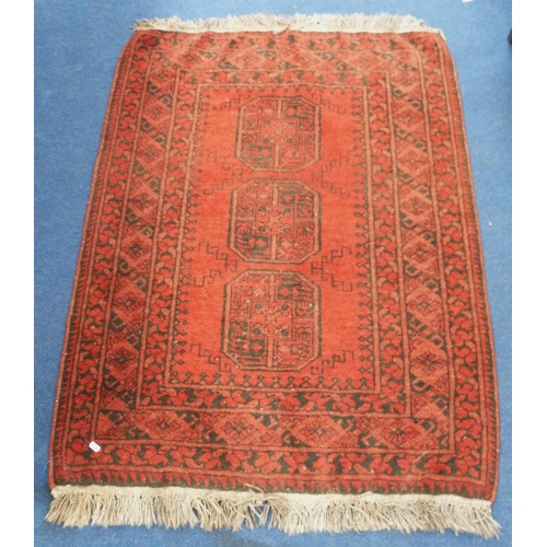 105 - Afghan Belouch rug with three octagonal geometric medallions to the centre within further geometric ... 