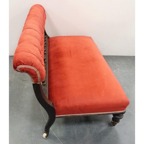 109 - Late Victorian aesthetic ebonised boudoir sofa, upholstered in later red button-back Dralon, with sp... 