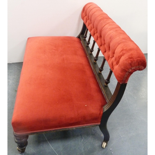 109 - Late Victorian aesthetic ebonised boudoir sofa, upholstered in later red button-back Dralon, with sp... 