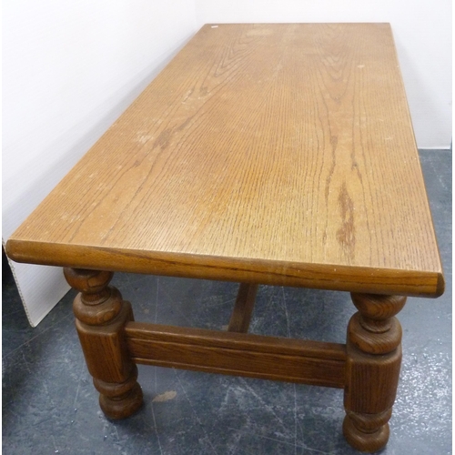 111 - Heavy oak coffee table with rectangular top on turned and block supports, 53cm high and 140cm wide.