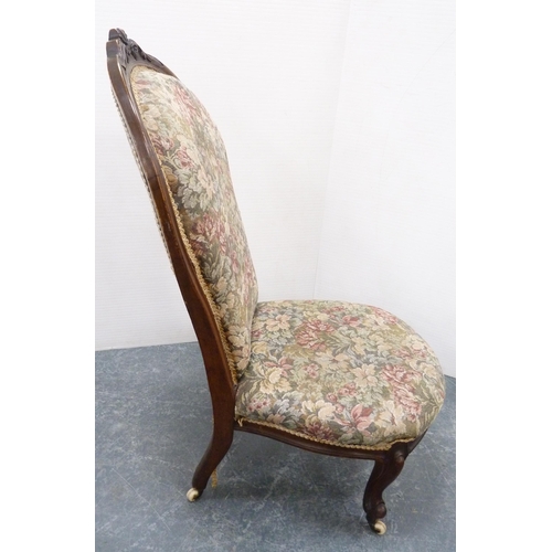 112 - Victorian walnut lady's spoon-back chair, upholstered in floral stuff-over fabric, on ceramic castor... 