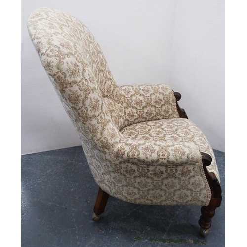 113 - Victorian mahogany-framed armchair, upholstered in later floral stuff-over fabric, on turned support... 