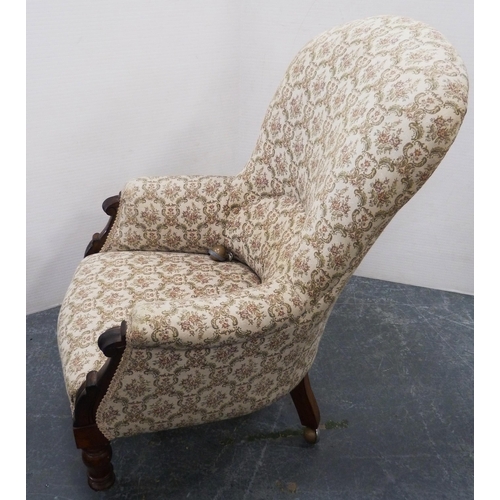 113 - Victorian mahogany-framed armchair, upholstered in later floral stuff-over fabric, on turned support... 