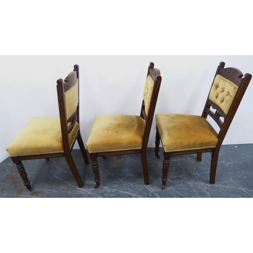 117 - Three matching mahogany dining chairs, c. early 20th century, upholstered in later mustard stuff-ove... 