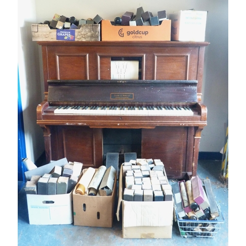 121 - Upright pianola by Crane & Sons Ltd., cased in mahogany, and a large quantity of pianola rolls.