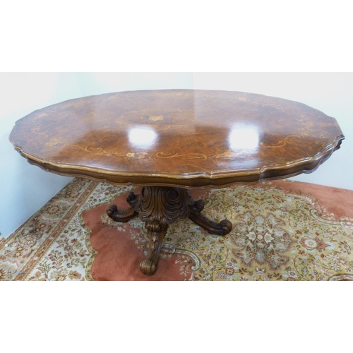 126 - Italian Sorrento-style walnut dining table with scroll inlay to the shaped top, on turned and carved... 